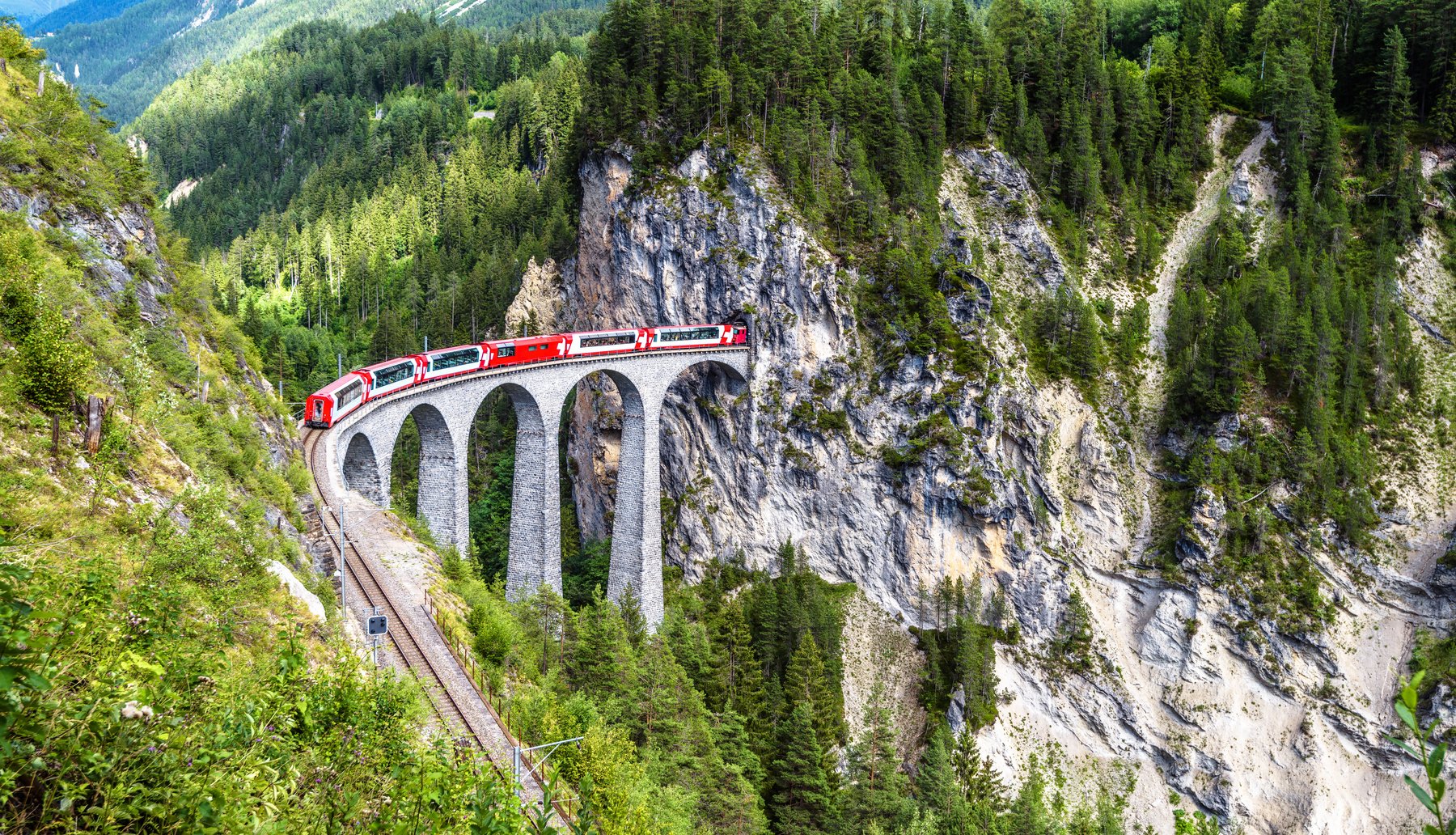 Landscape with Landwasser Viaduct in summer, Filisur, Switzerland. Rhaetian glacier express runs on amazing railway.